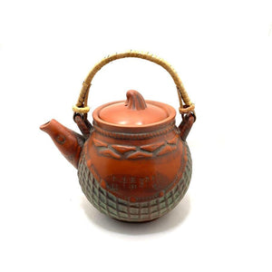 Tetera oriental de cerámica con filtro