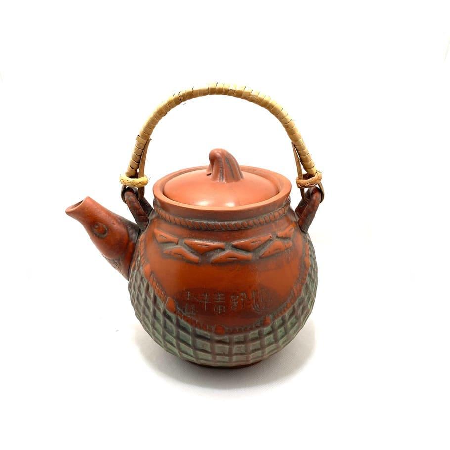 Tetera oriental de cerámica con filtro